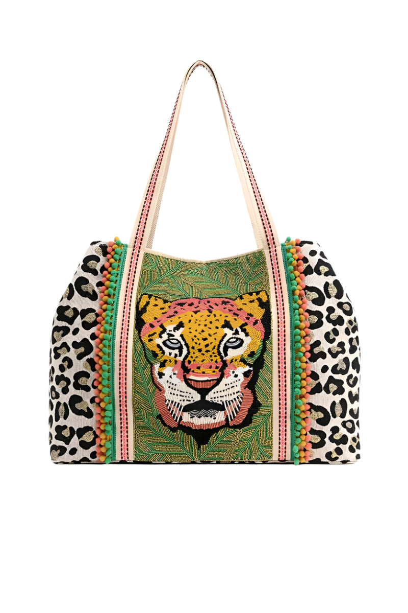 Tote bag with leopard print and embroidered tiger face design on a white background