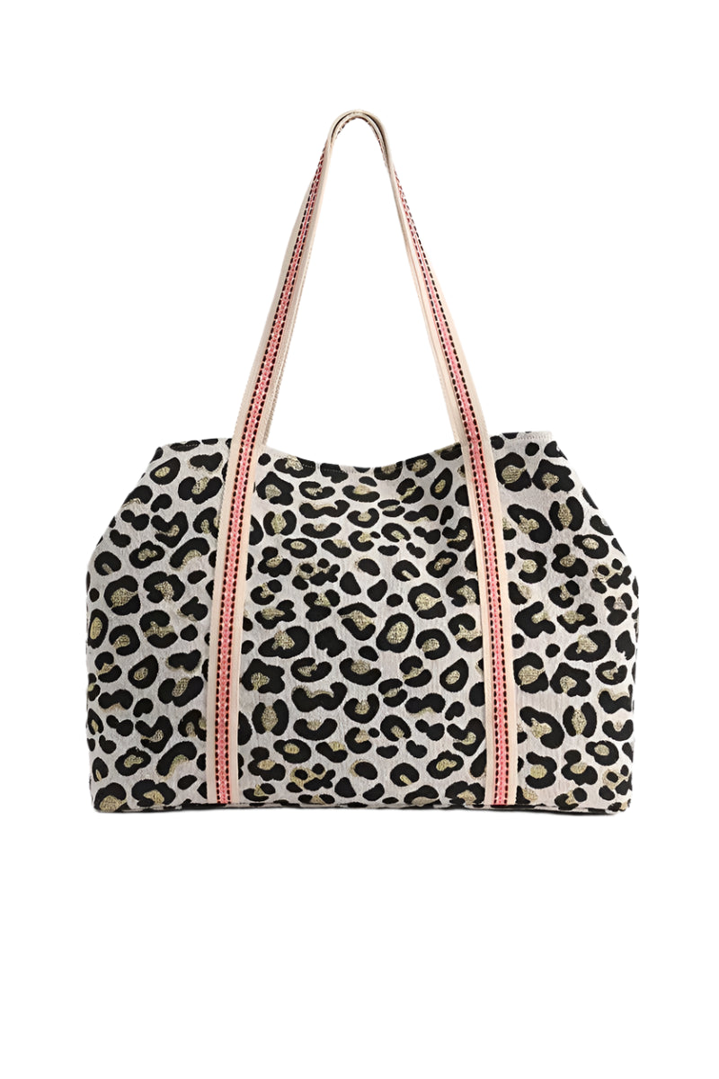 Leopard print bag with pink straps on a white background