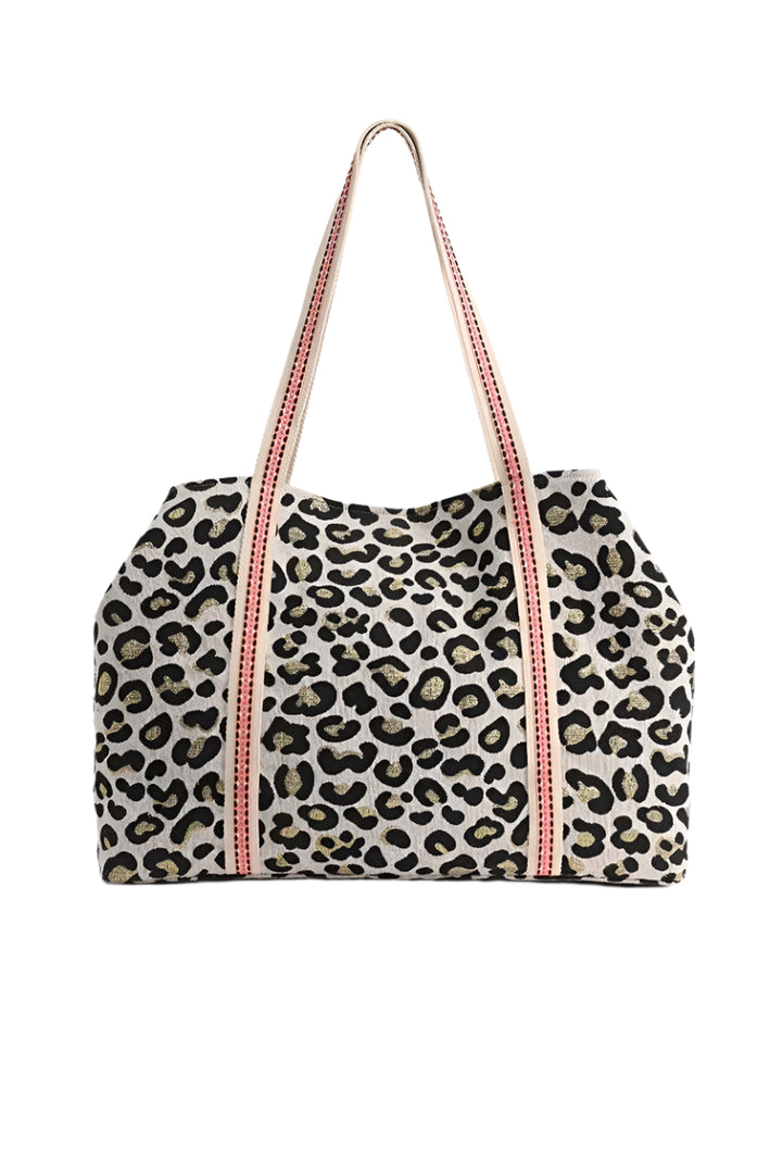 Leopard print bag with pink straps on a white background